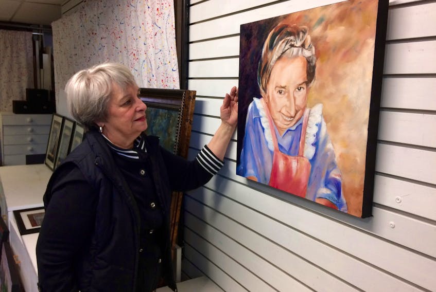 Yarmouth artist Tootsie Emin with a painting she did of Maud Lewis. This piece is part of a show titled Treasured Memories of Maud, a collection of works by Emin that will be on display at the Yarmouth County Museum from May 12 to July 28.