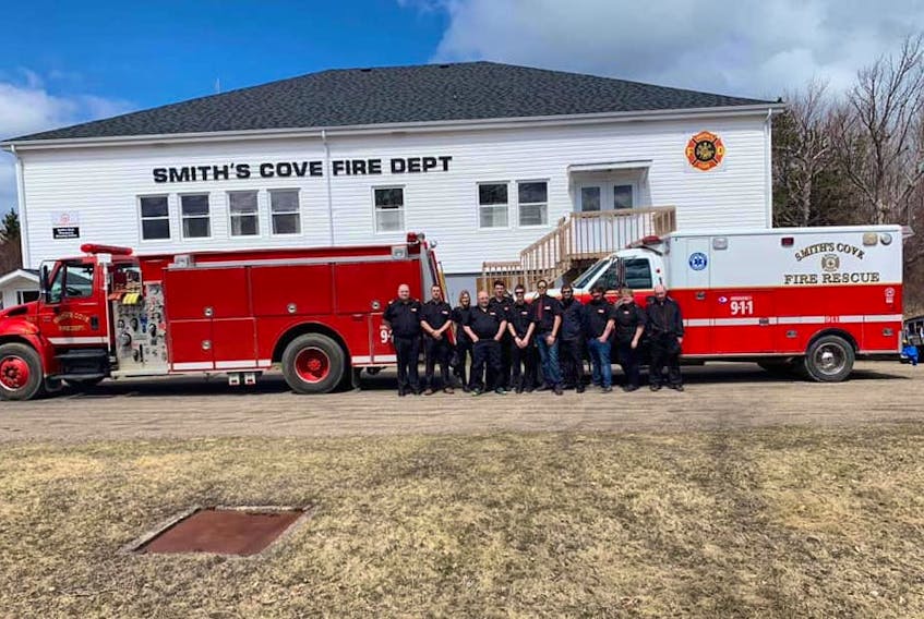 Some members of the Smith’s Cove Fire Department posing for a picture that was entered in the fire hall photo contest that is organized annually by AA Munro Insurance. Smith’s Cove ended up winning the first prize of $5,000 after the Reserve Mines Fire Department – whose entry had seemed destined to win the contest – pulled out.