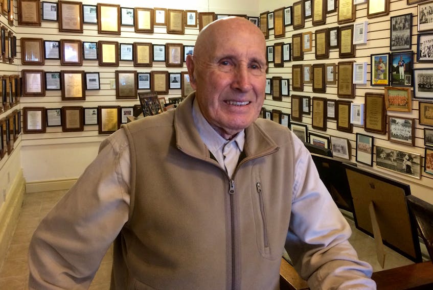 Tom White in the Yarmouth Sports Heritage Museum (435 Main St.), where visitors will find, among other things, 20 years’ worth of Hall of Fame plaques, photos and bios. ERIC BOURQUE PHOTO