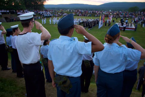Cadets proudly saluting.