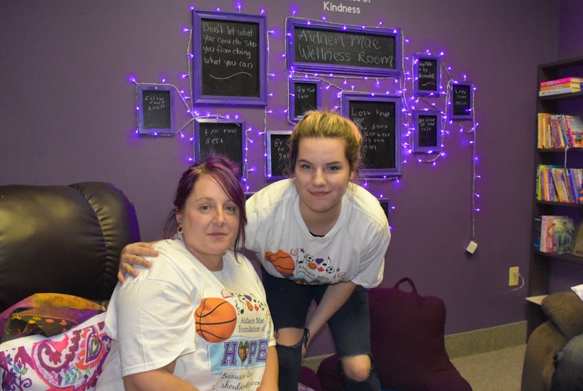 Kelly Mitchell, mother of Aidaen Mae Mitchell, and Laura Hanlon, who was a friend of Aidaen's, inside the Aidaen Mae Mitchell Wellness Room that is a component of the Tri County Mental Health and Wellness drop-in centre at 101 Water St. TINA COMEAU PHOTO