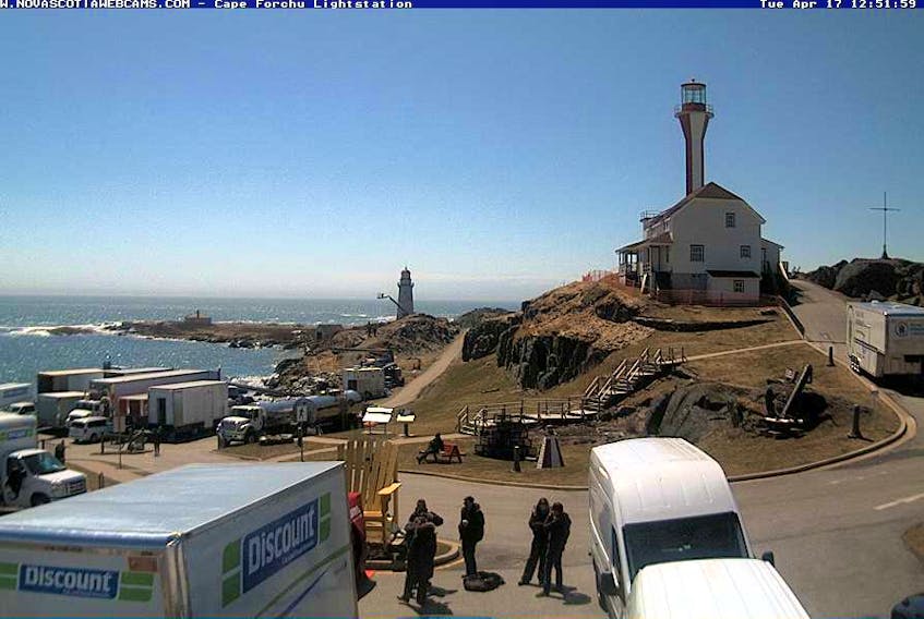 A Nova Scotia webcam shot of the Cape Forchu lighthouse with the film lighthouse in the background during spring 2018.