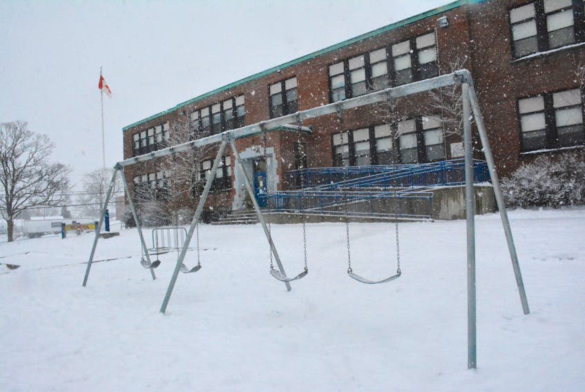 An empty Yarmouth Central School play yard and building after students had an early dismissal due to pending weather.