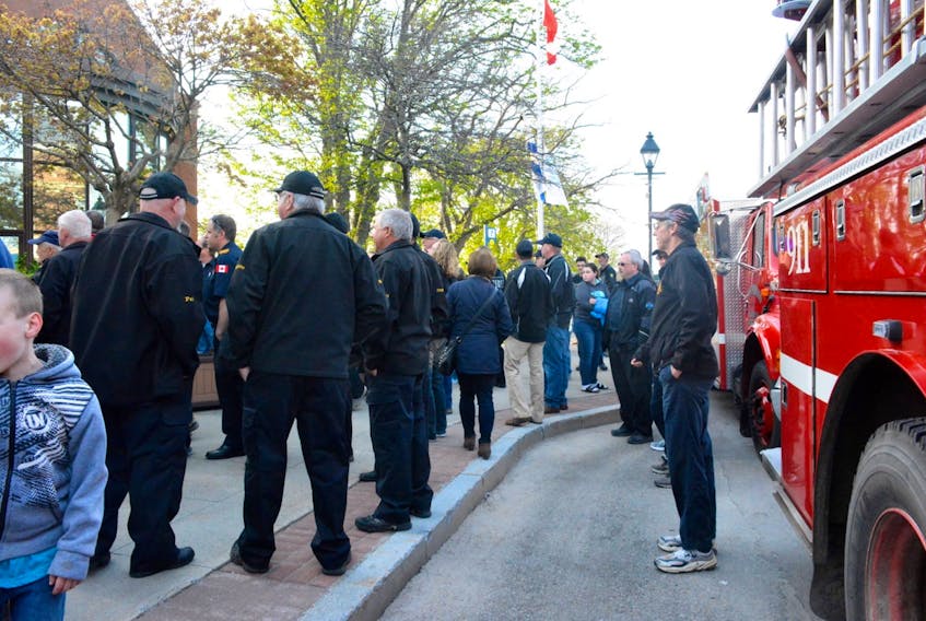 Fire departments, firefighters and members of the public protested outside the Yarmouth Town Hall on May 17. The town has said it will be exploring the cost of outsourcing its dispatch services. In a presentation to council they were asked to reconsider and maintain the dispatch service as it is. TINA COMEAU PHOTO