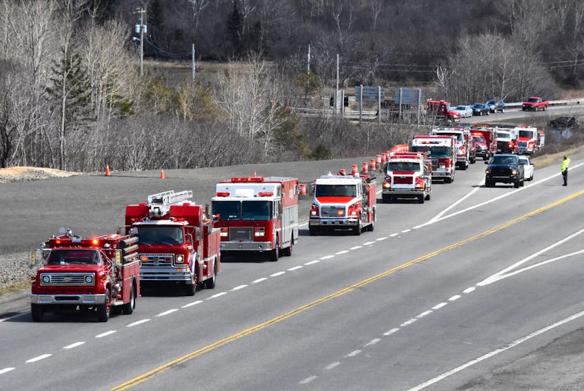 A procession of fire trucks made its way from Digby to the Brighton-Barton Fire Department fire hall on April 17 in honour of fire chief Cliff Surrett who died earlier in the month. TINA COMEAU PHOTO