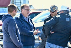 West Nova Conservative candidate Chris d'Entremont speaks to people after outlining the Conservatives' platform on the fisheries during an announcement he made in West Pubnico on Oct. 6.