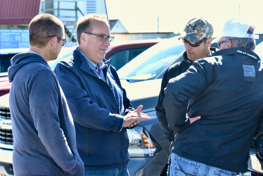 West Nova Conservative candidate Chris d'Entremont speaks to people after outlining the Conservatives' platform on the fisheries during an announcement he made in West Pubnico on Oct. 6.