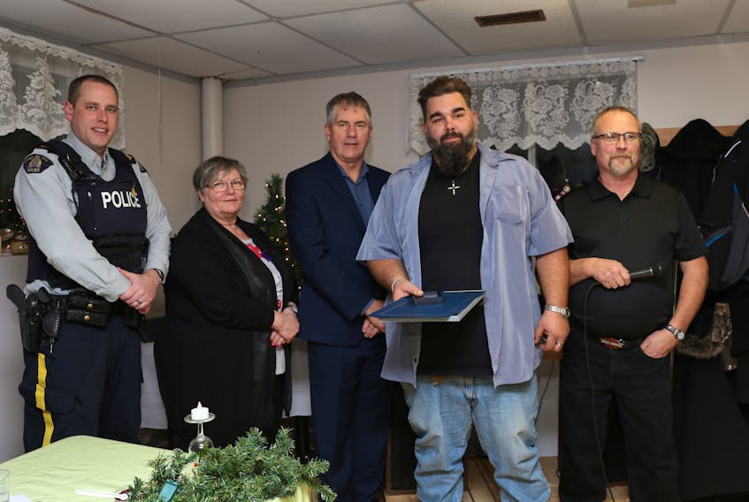 DGSAR volunteer Brian Maling receives a certificate and award for five years of service from Cpl. Mike MacAulay, left, of RCMP Digby detachment and Digby Municipal Deputy Warden Linda Gregory and Warden Jimmy MacAlpine while DGSAR president Larry Brooks looks on. KARLA KELLY