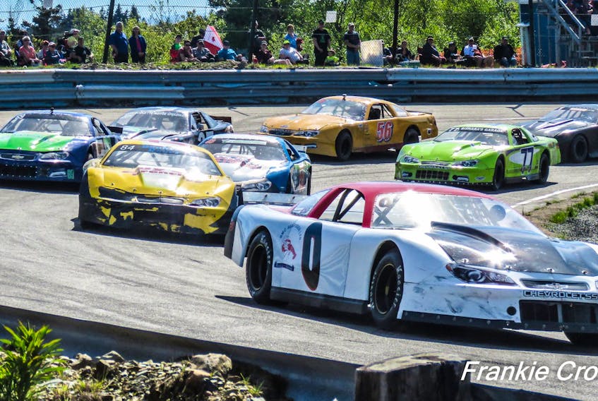 The cars round the track at Lake Doucette Motor Speedway. FRANKIE CROWELL PHOTO