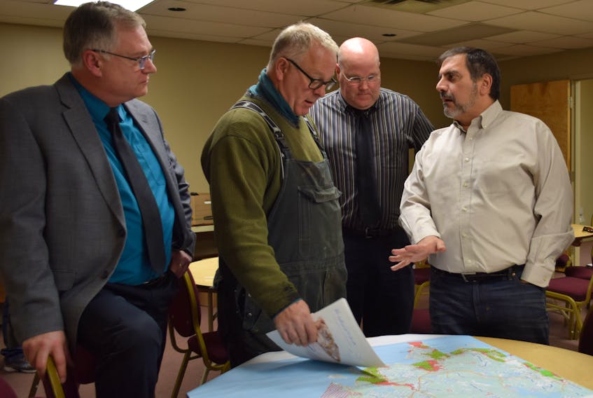 From left: Acting area manager for DFO Mark Connelly, Barrington Municipal Warden Eddie Nickerson, DFO officer Dan Fleck and Environment Canada representative Paul Japiezien talk about clam harvesting and the potential pilot project for Shelburne County that would see clam flats in the area regularly tested for biotoxins and water quality.