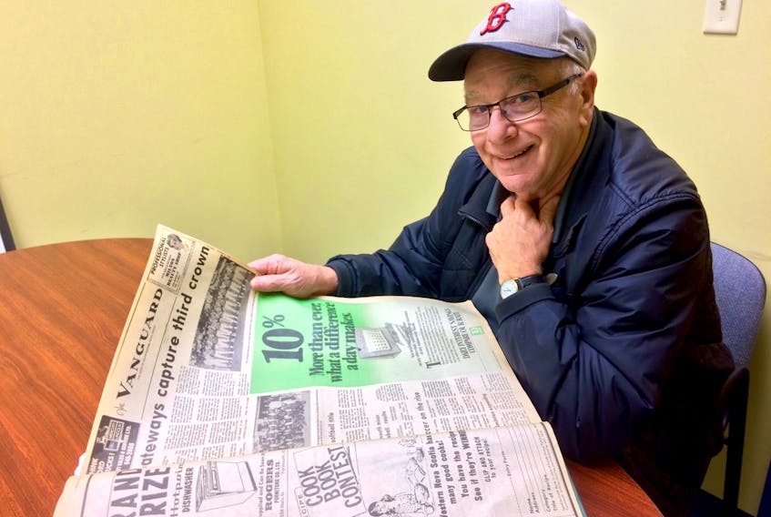 Keith Bridgeo looks over a story from a 1979 edition of the Vanguard newspaper, with the headline “Gateways capture third crown.” Bridgeo was player/coach for the Yarmouth team that won the Nova Scotia Senior Baseball League title three straight years in the late 1970s.