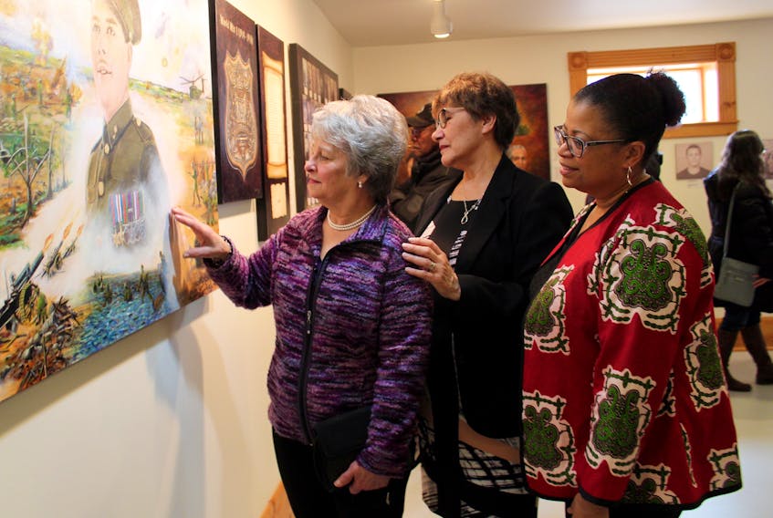 From left: Tootsie Emin, Sharon Robart-Johnson and Tracey Thomas get a closer look at one of the pieces in an exhibit showcasing the Yarmouth area’s African Nova Scotian community at the Yarmouth County Museum. Emin did the paintings that are in the exhibit, which is now a permanent part of the museum. Robart-Johnson is a member-at-large of the board of directors of the Yarmouth County Historical Society. Thomas is with African Nova Scotian Affairs and based in Halifax. An official opening for the exhibit was held March 16.