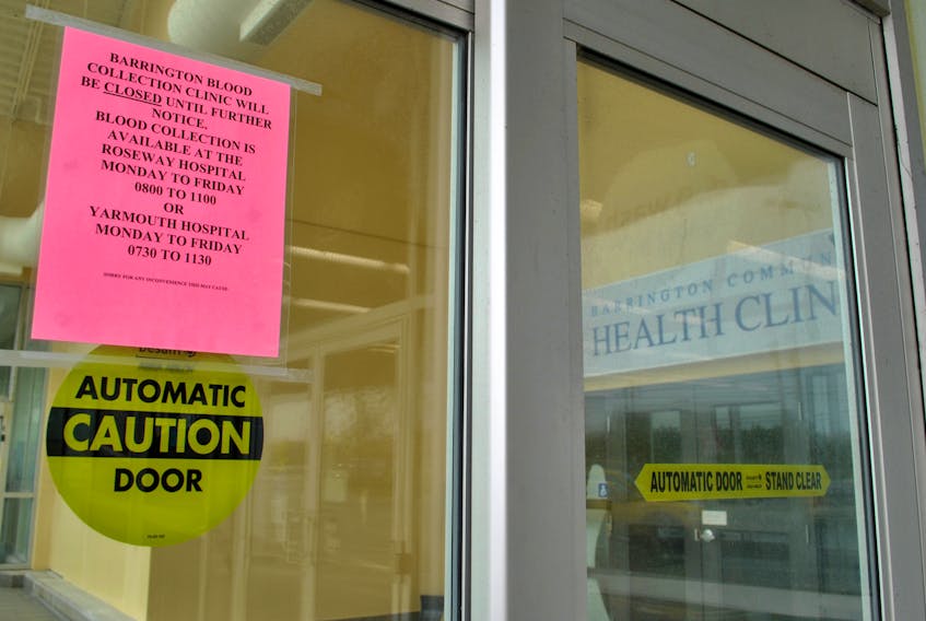 A sign indicating a closure of the Barrington Community Health Clinic.