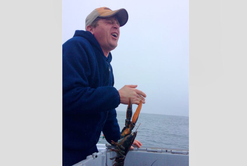 Cape Sable Island fisherman Todd Newell let a  lobster clamp down on his hand to raise money for a father battling a rare form of cancer.
