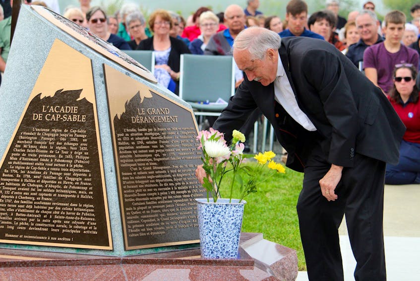 Msgr. Gérald LeBlanc – pictured in July 2017 laying a flower at the unveiling of an Acadian Odyssey monument in West Pubnico – died Sunday, March 11, at the age of 82. His funeral was held Wednesday, March 14, in West Pubnico.