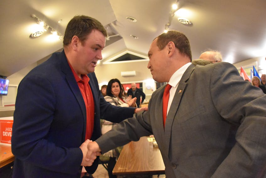 Liberal candidate Jason Deveau and former West Nova Liberal MP Colin Fraser shakes hands at the end of the election night, that didn't work out in the Liberals' favour in West Nova. TINA COMEAU PHOTO