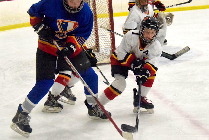 Peewee A players from Digby-Clare and Shelburne battle for the puck in the Flames’ end zone during round robin Fall Classic action.