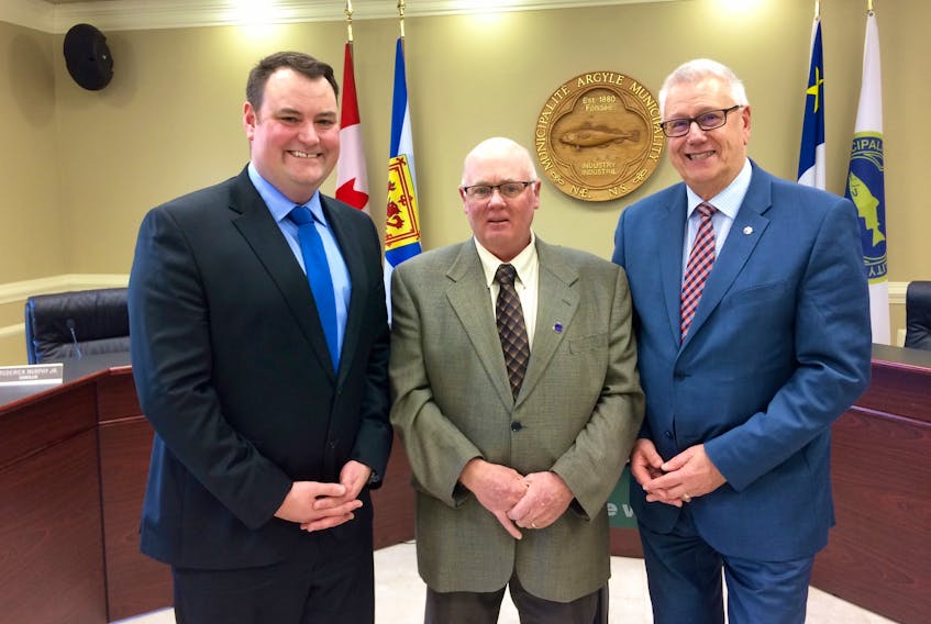 West Nova MP Colin Fraser, Argyle Warden Richard Donaldson and Bill Karsten, Halifax Reginal Municipality councillor and first vice-president of the Federation of Canadian Municipalities at the Argyle municipal office in Tusket on Thursday, Nov. 15.