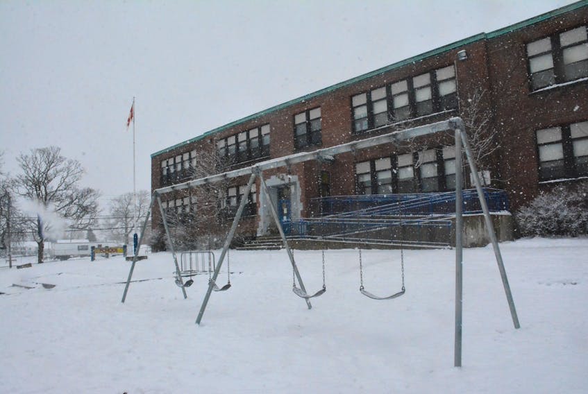 Am empty school playground on a snowy day.