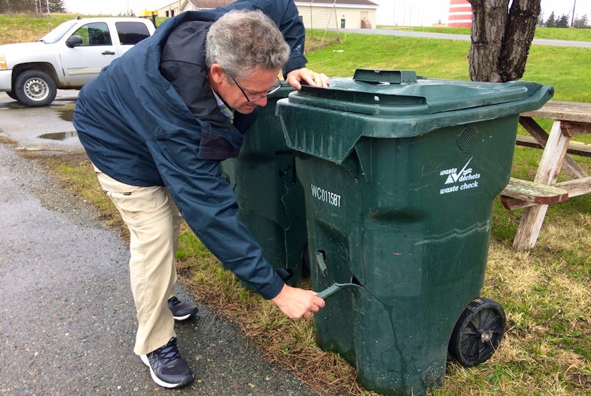 Gus Green, general manager of Waste Check, with an example of a damaged green cart. People who want to have their cart repaired or replaced can contact Waste Check, which serves Yarmouth and Digby counties.