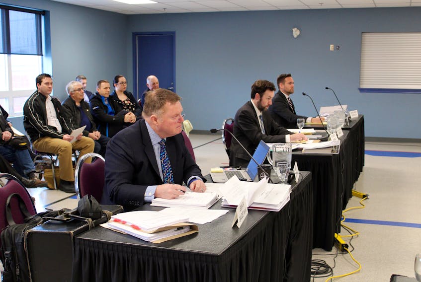 Lawyers occupy the front tables during a May 14 hearing of the Nova Scotia Utility and Review Board at the Mariners Centre in Yarmouth. From left: Gavin Giles, representing a group of people appealing a decision by the Municipality of Argyle to approve a development agreement for a sea cucumber processing facility in Tusket; Richard W. Norman, representing the Municipality of Argyle; and Jocelin d’Entremont, representing Jules LeBlanc, the project developer.