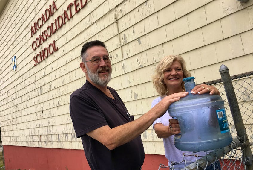 Th’YARC president Mitch Bonnar and secretary Shari Deveau-Surette at the former Arcadia school. Th’YARC is partnering with the Municipality of Yarmouth to provide free water to residents in need.