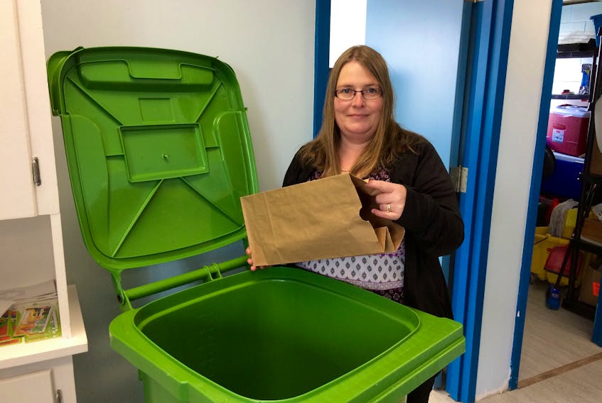 Amy Hillyard, waste reduction co-ordinator with Waste Check, reminds people that paper bags containing compostable material can go in the green cart, but things like plastic should be kept out of the cart.