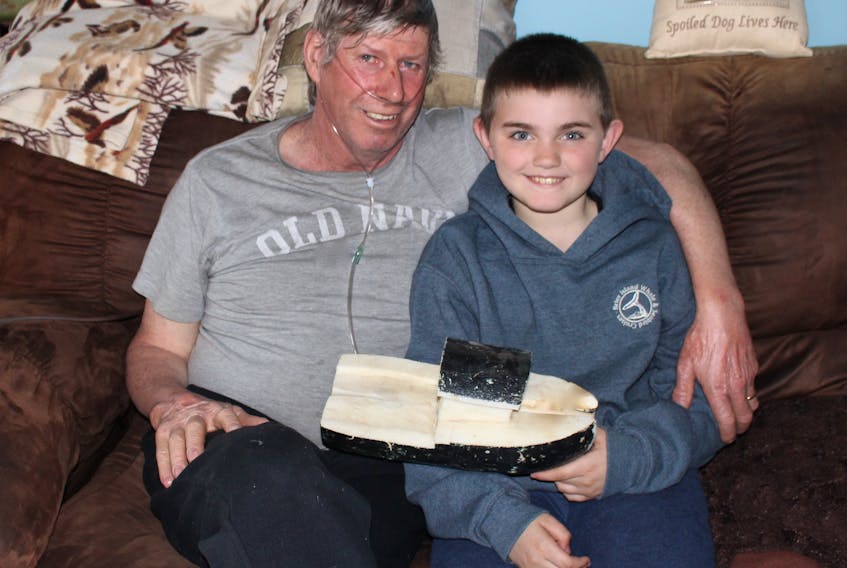 Tom Albright and his grandson, Tegan Theriault made a boat out of a buoy and set sail to it off Brier Island. They attached a note, hoping whoever finds it will track the boats movements on their Facebook page.