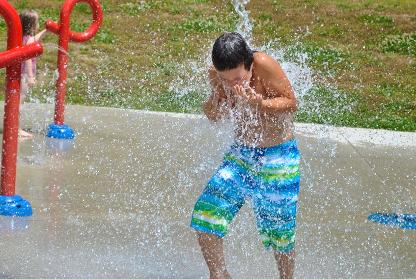 Cooling off at the splash pad at Graham's Park in Shelburne during a recent sunny, summer day.