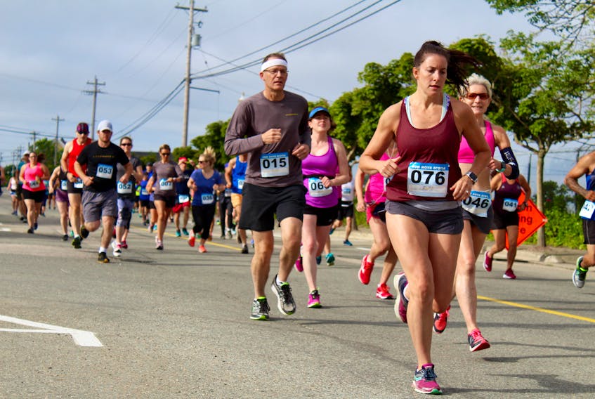 An image from the Sheila Poole 10K of 2018, as some of the runners make their way along Water Street in the event’s opening moments.
