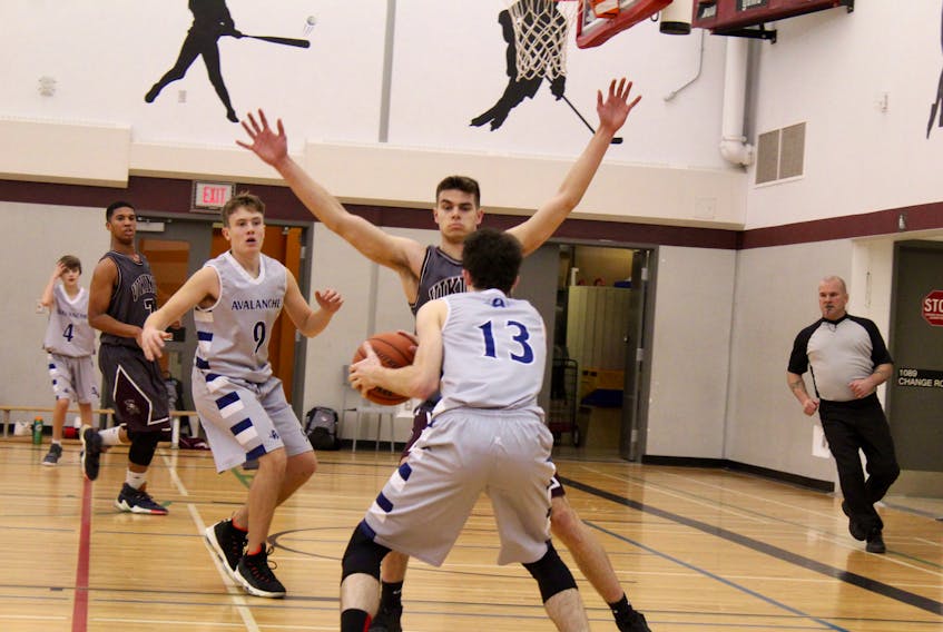 Dylan Landry of YCMHS (arms raised) is pictured during a Feb. 6 home game against Avon View. Teammate Randal Fells (7) is picture at left. The Vikings went 1-1 at the regionals at Horton and will play host to Citadel High School in a qualifier for provincials. A date for the game has yet to be announced.