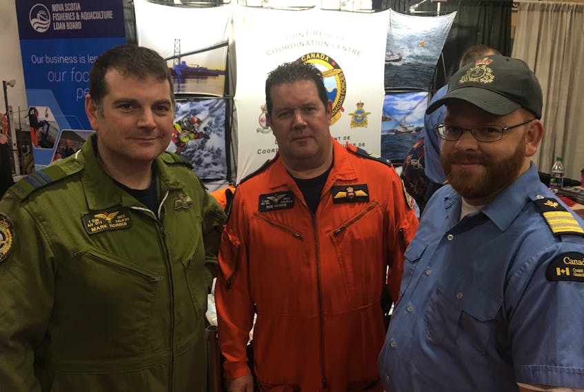 Major Mark Norris, JRCC (Joint Rescue Coordination Centre) Halifax commanding officer, with Sgt. Rob Hardie, JRCC assistant air coordinator and advisor for SarTech operations, and Marc Ouellette, Canadian Coast Guard regional supervisor for Maritime Search and Rescue at JRCC. The officers were on hand to meet the public during the Eastern Canadian Fisheries Expo at the Mariners Centre in Yarmouth Jan. 25 and 26.