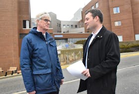 Dr. Drew Bethune, the medical director of Nova Scotia Cancer Care, and provincial Health and Wellness Minister Randy Delorey, stand outside the Yarmouth Regional Hospital on Jan. 30. They were in town to deliver the results of a cancer care review. TINA COMEAU