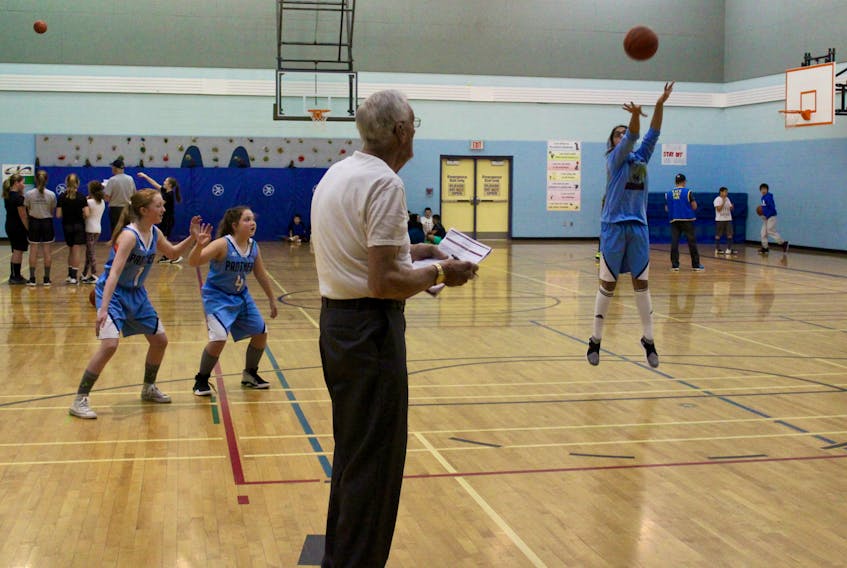 Cal Kent (foreground, pen and paper in hand) was among those helping with the Knights of Columbus free-throw contest held Jan. 22 in Yarmouth at Meadowfields Community School. Kent is district deputy for the Knights.
