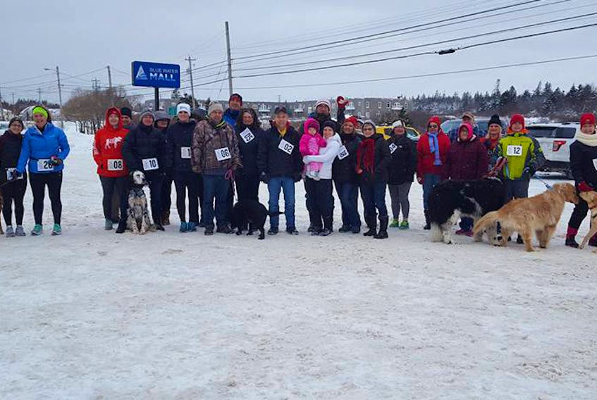 Participants in last year’s Dog Jog in Barrington Passage pose for a  photo.