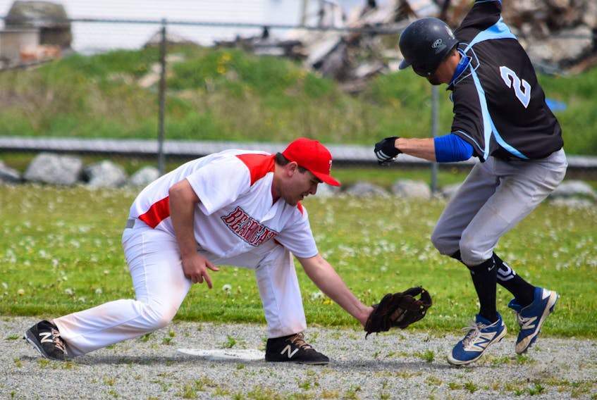 Shelburne Schooners' runner Keith Nickerson is tagged out at second by an unidentified Truro Bearcats' player during the Schooner's season opener on June 2 in Clark's Harbour.