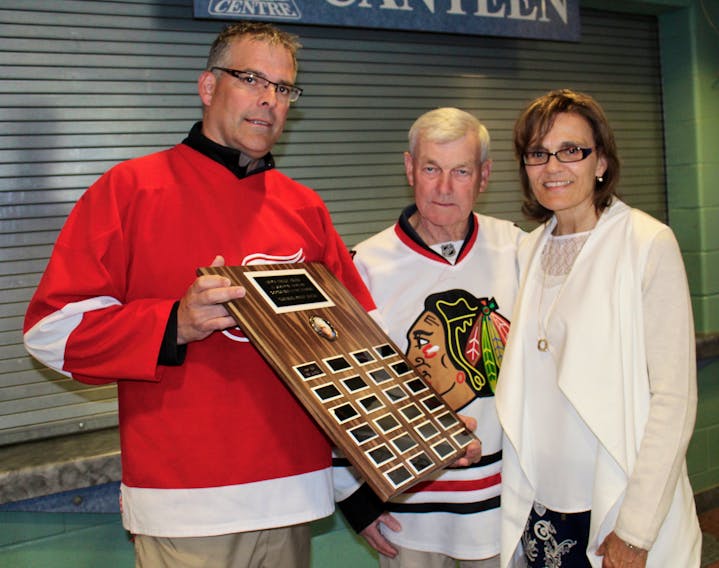 From left, Frank Grant, league rep for Yarmouth’s over-40 hockey league; Bob Durkee, recipient of the league’s new sportsmanship award in memory of Imrich Kiraly; and Robbi Seale, Kiraly’s widow.