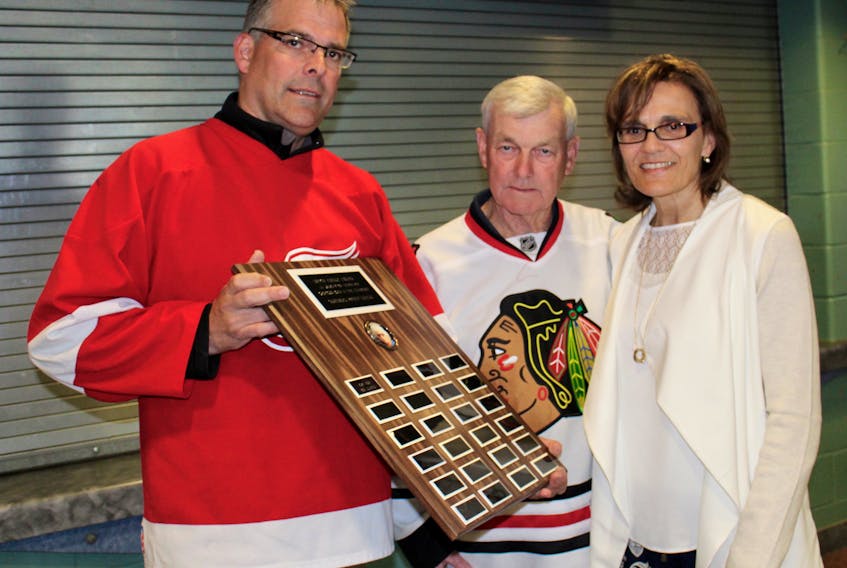 From left, Frank Grant, league rep for Yarmouth’s over-40 hockey league; Bob Durkee, recipient of the league’s new sportsmanship award in memory of Imrich Kiraly; and Robbi Seale, Kiraly’s widow.
