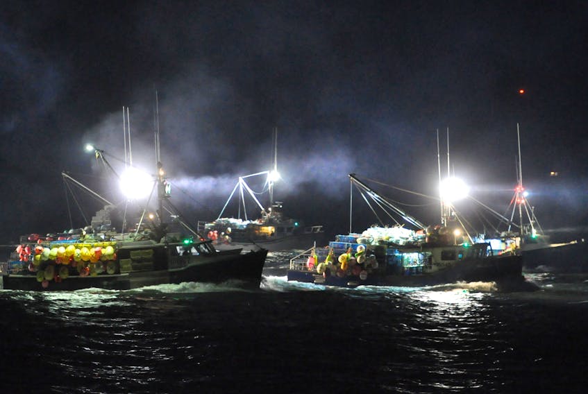 Boats head out to the fishing grounds during a previous dumping day. TINA COMEAU PHOTO