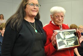 Betty Lovitt (right) and her family was presented with the Nova Scotia Archaeology Society's annual Friend of Archaeology Award for their stewardship of the Fort St. Louis site by Dr. Katie Cottreau-Robins, curator of archaeology for the Nova Scotia Department of Communities, Culture and Heritage, at the May 19 presentation in Barrington on the archaeology research project at Fort St. Louis in Port La Tour. KATHY JOHNSON PHOTO