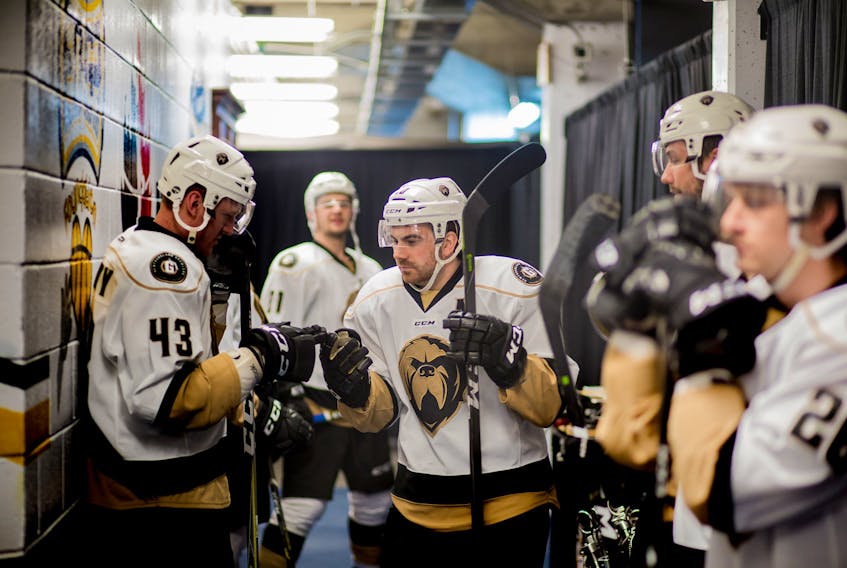 Captain James Melindy (43) and the rest of the Newfoundland Growlers welcomed leading scorer Zach O'Brien (centre) back into the lineup before Friday's ECHL game against the Manchester Monarchs at Mile One Centre in St. John's.