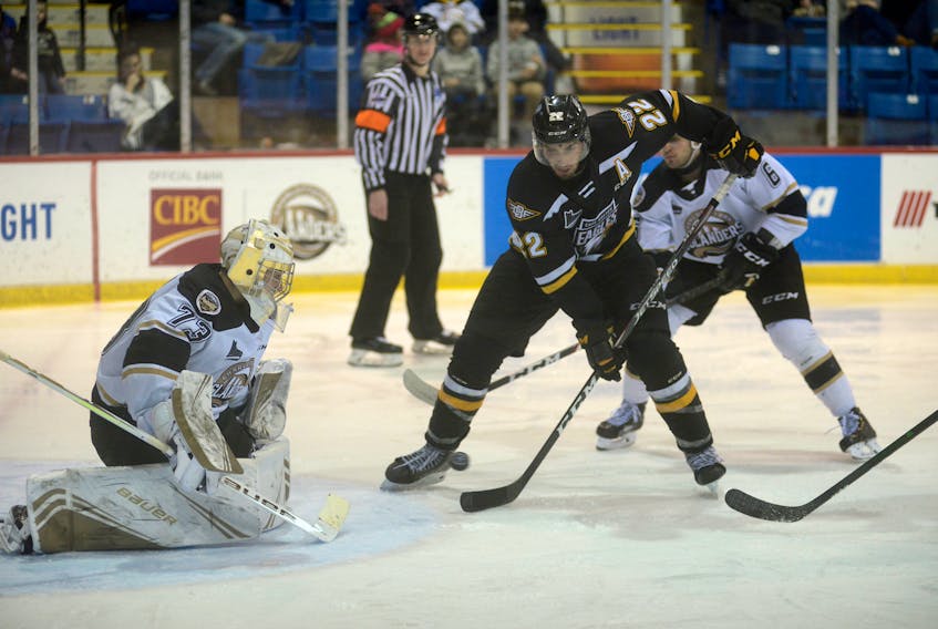 Cape Breton Eagles winger Shawn Boudrias tries to tip a puck past Charlottetown Islanders goalie Matthew Welsh Friday at the Eastlink Centre. Both were drafted by the Islanders in 2015.