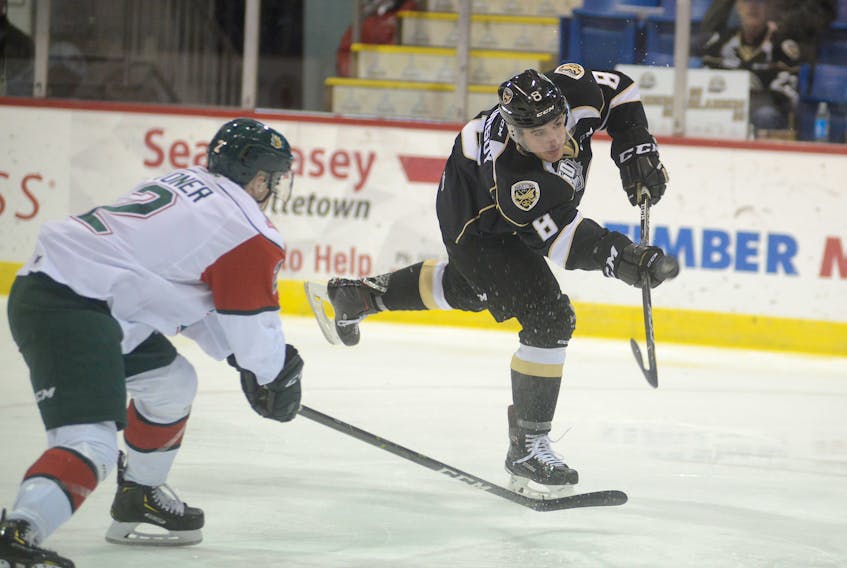 Charlottetown Islanders right-winger Kevin Gursoy fires a shot while being defended by Denis Toner of the Halifax Mooseheads Sunday at the Eastlink Centre.
