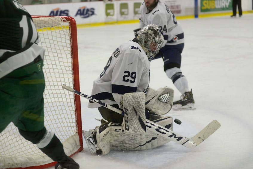 St. FX X-Men goalie Blade Mann-Dixon makes a save during the second period of Saturday's Atlantic University Sport men's hockey game with the host UPEI Panthers at MacLauchlan Arena.
