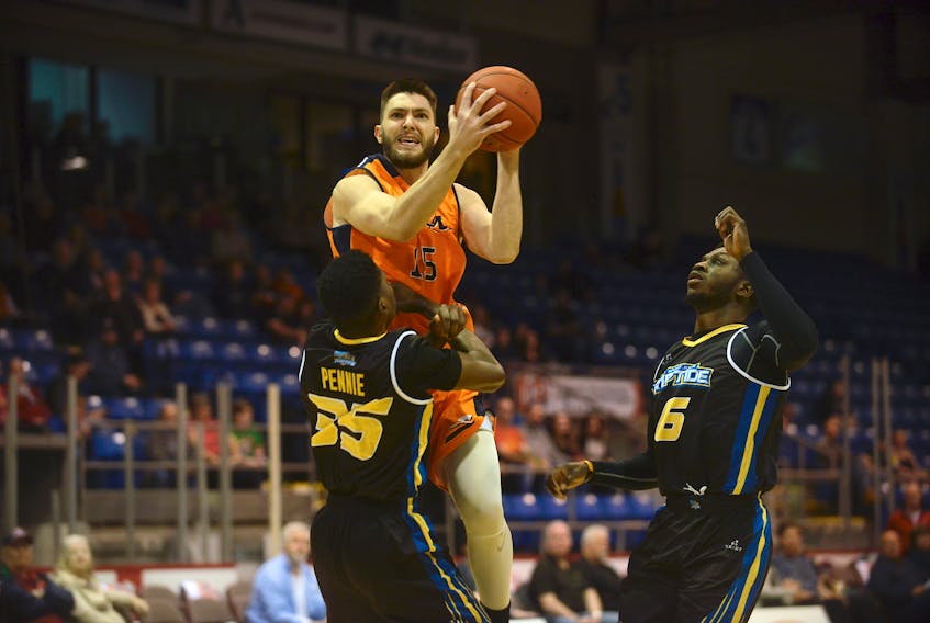 Island Storm forward Kyle Arseneault, a Fredericton, N.B., native, drives to the paint on Saint John Riptide forward Jalyn Pennie Sunday during National Basketball League of Canada action in Charlottetown.