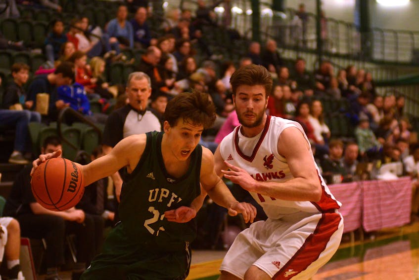 Bryce Corless, left, is in his rookie season with the UPEI Panthers men's basketball team.