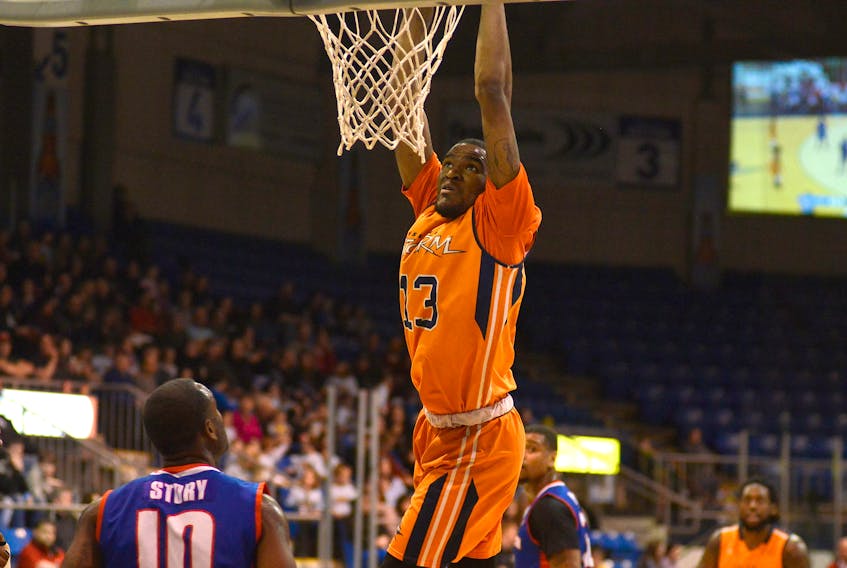 Island Storm forward dunks the ball during first half action at the Eastlink Centre Saturday against the Cape Breton Highlanders.