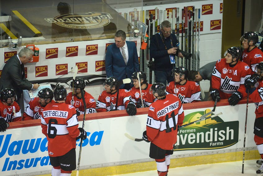 Charlottetown Islanders head coach Jim Hulton, centre, looks on as Drummondville Voltigeurs head coach Dominique Ducharmes draws up a play for Team QMJHL during the 2017 CIBC Canada Russia Series game at the Eastlink Centre.