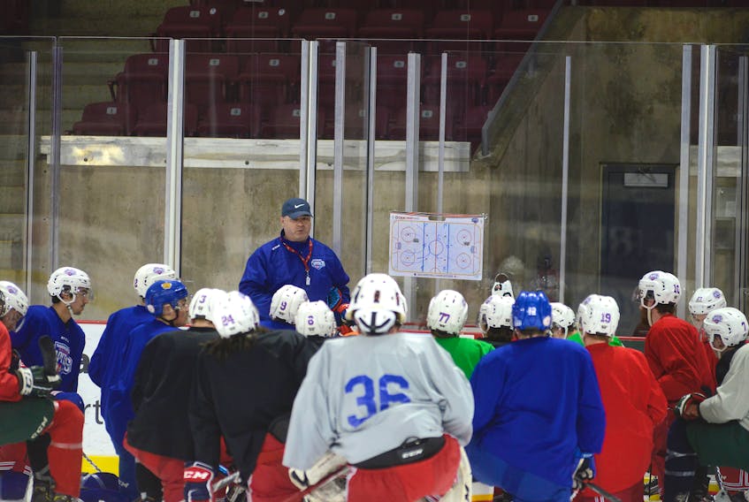 Head coach Billy McGuigan speaks with his Summerside D. Alex MacDonald Ford Western Capitals during Tuesday's practice at Credit Union Place.