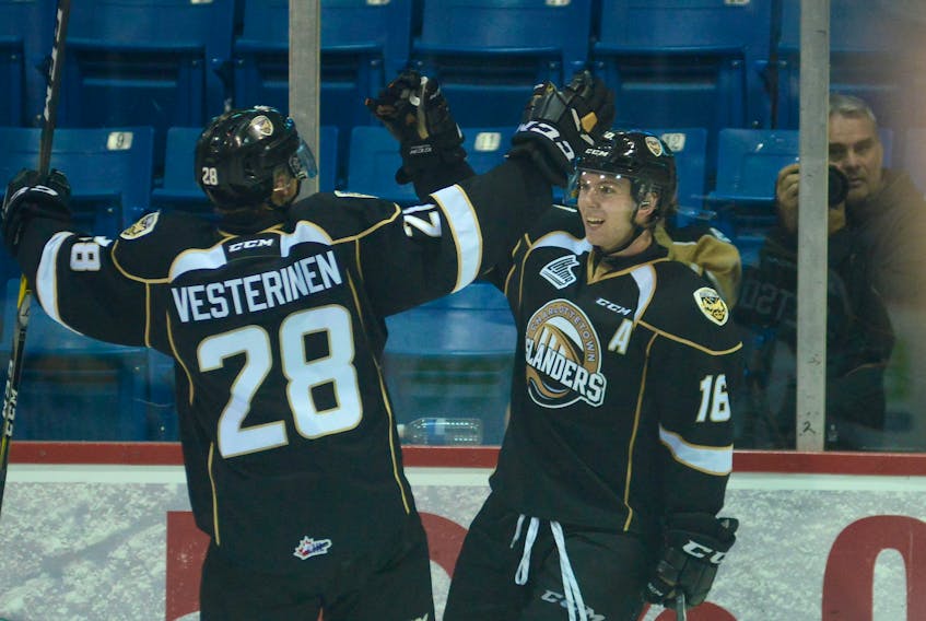 Charlottetown Islanders teammates Keith Getson, right, and Saku Vesterinen celebrate a goal against the Quebec Remparts on Oct. 7, 2017.